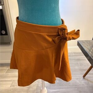 Vibrant Red Mini Skirt with Flattering Fit and Bow Detail